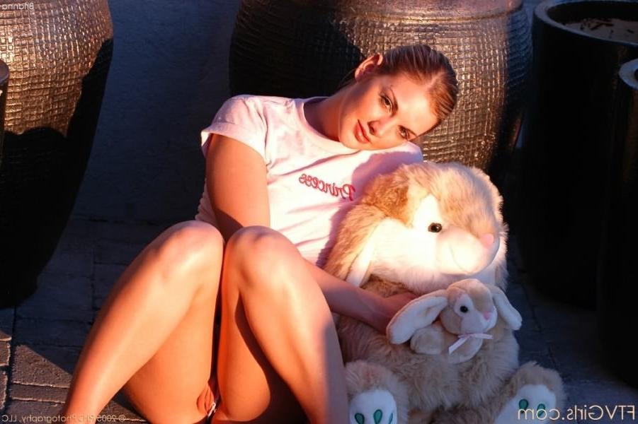15P Blonde plays with bunny outside and masturbating