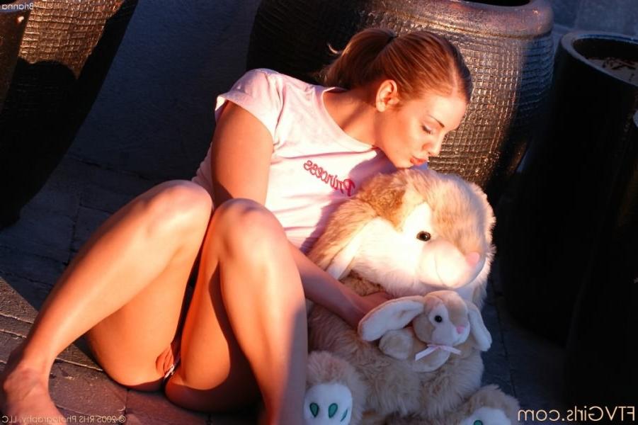 15P Blonde plays with bunny outside and masturbating