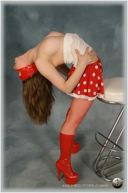 16P Contortionist poses in red fishnet stockings