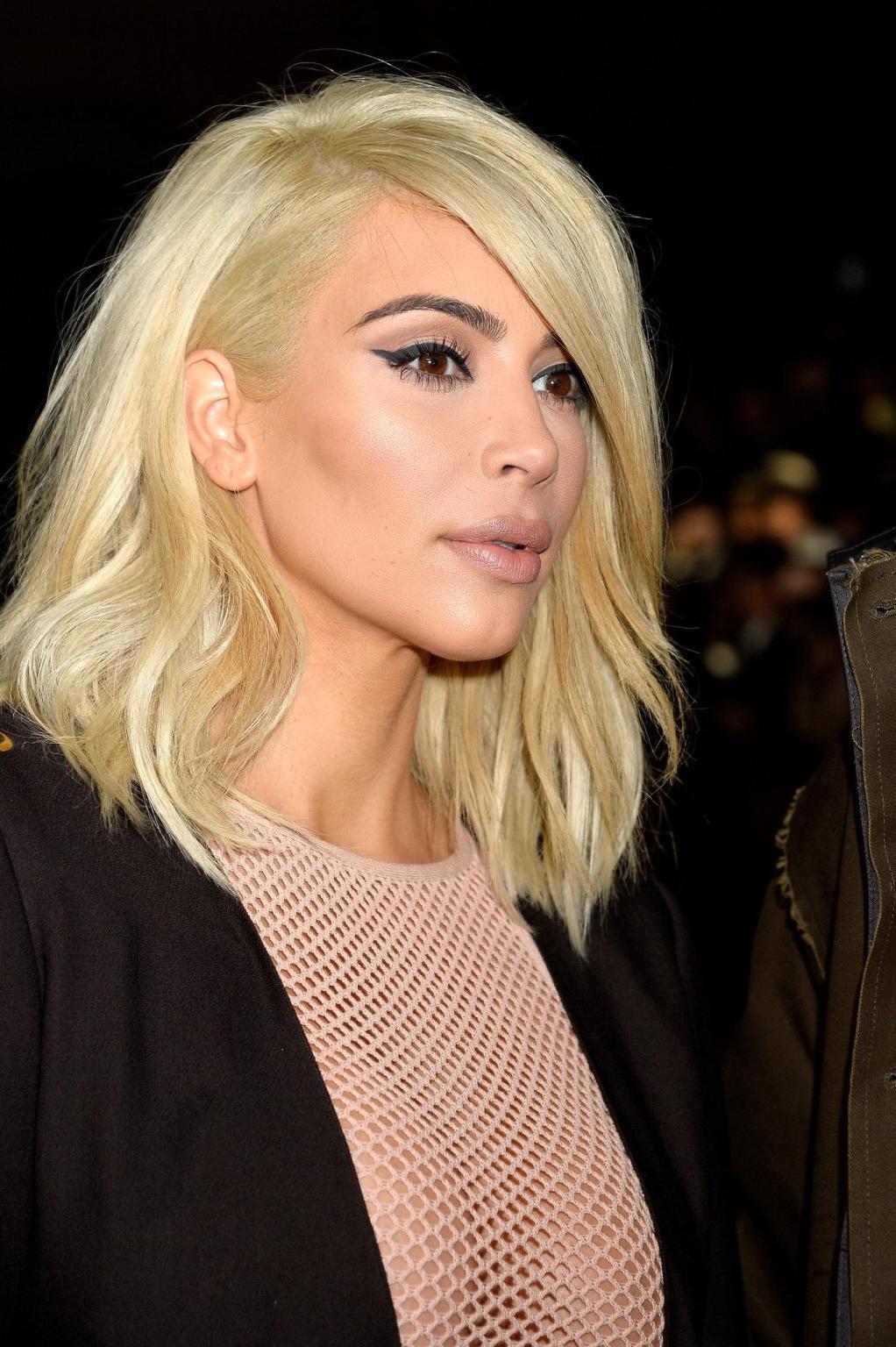 16P Kim Kardashian shows off her huge boobs braless in a fishnet dress at the Lanvin