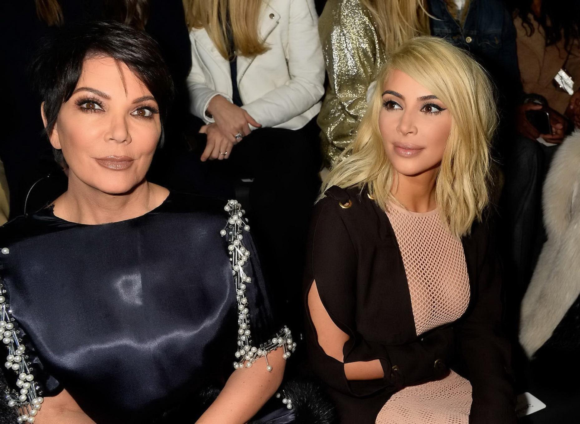 16P Kim Kardashian shows off her huge boobs braless in a fishnet dress at the Lanvin