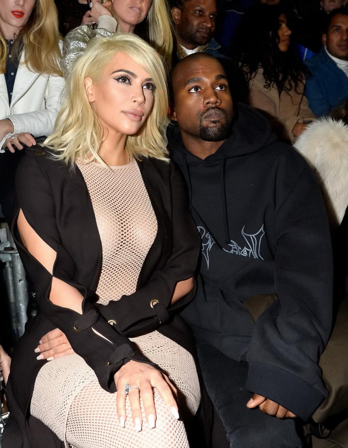 16P Kim Kardashian shows off her huge boobs braless in a fishnet dress at the Lanvin