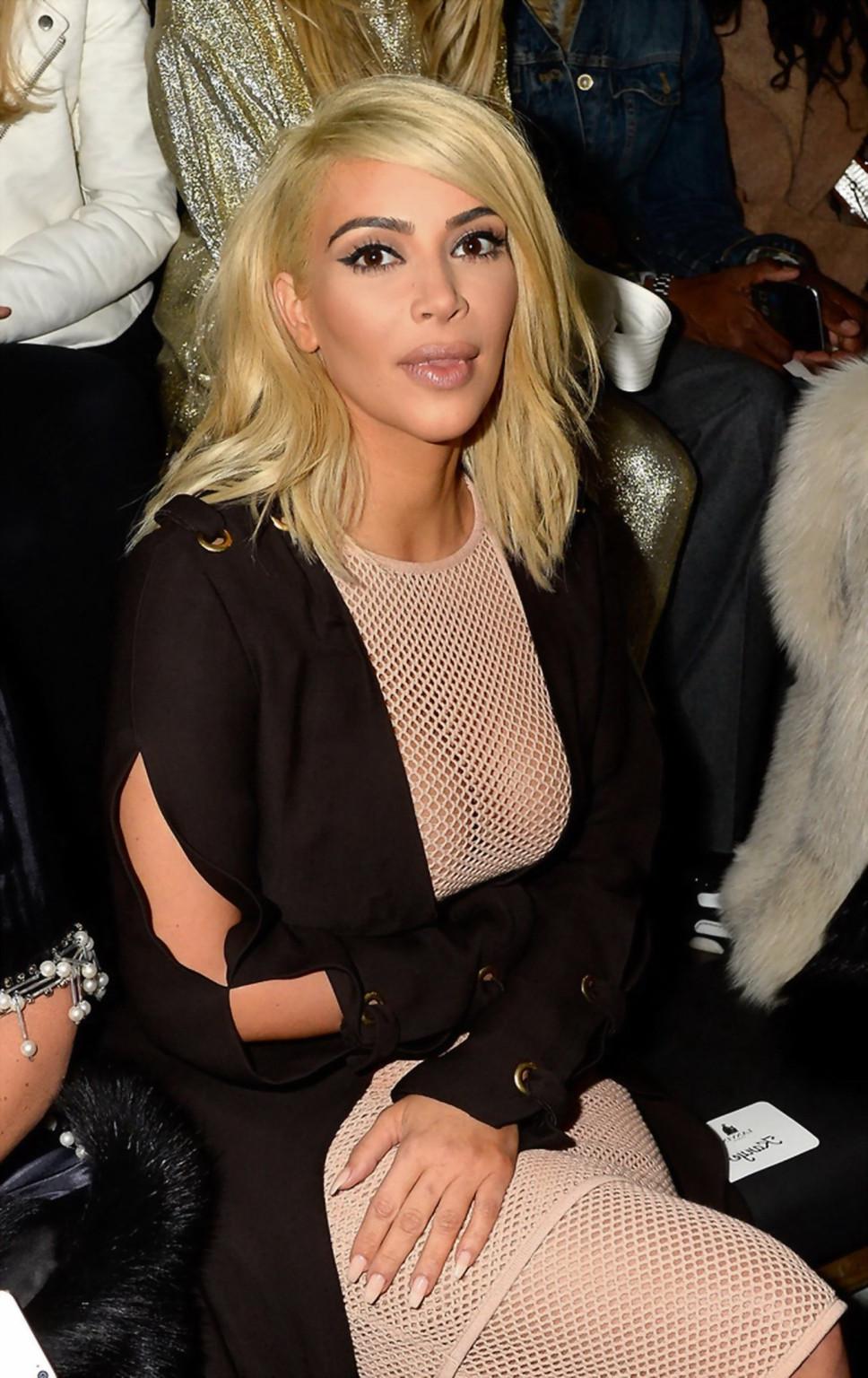 16P Kim Kardashian shows off her huge boobs braless in a fishnet dress at the Lanvin