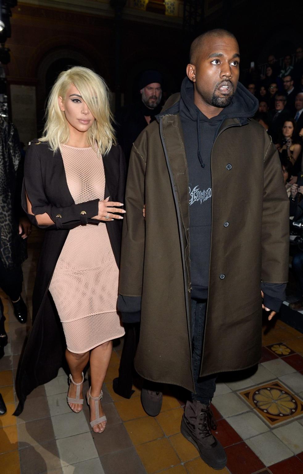 16P Kim Kardashian shows off her huge boobs braless in a fishnet dress at the Lanvin