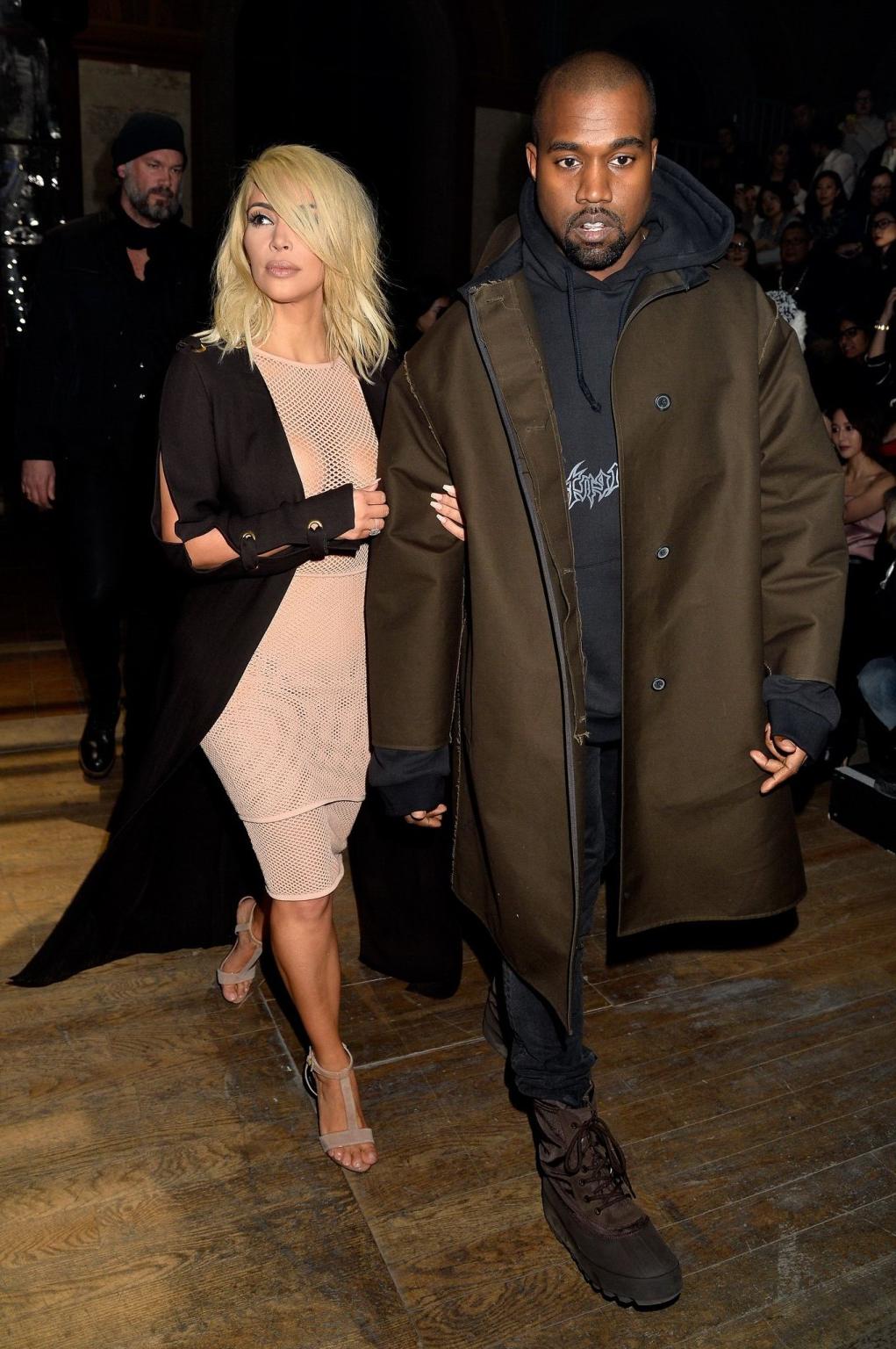 16P Kim Kardashian shows off her huge boobs braless in a fishnet dress at the Lanvin
