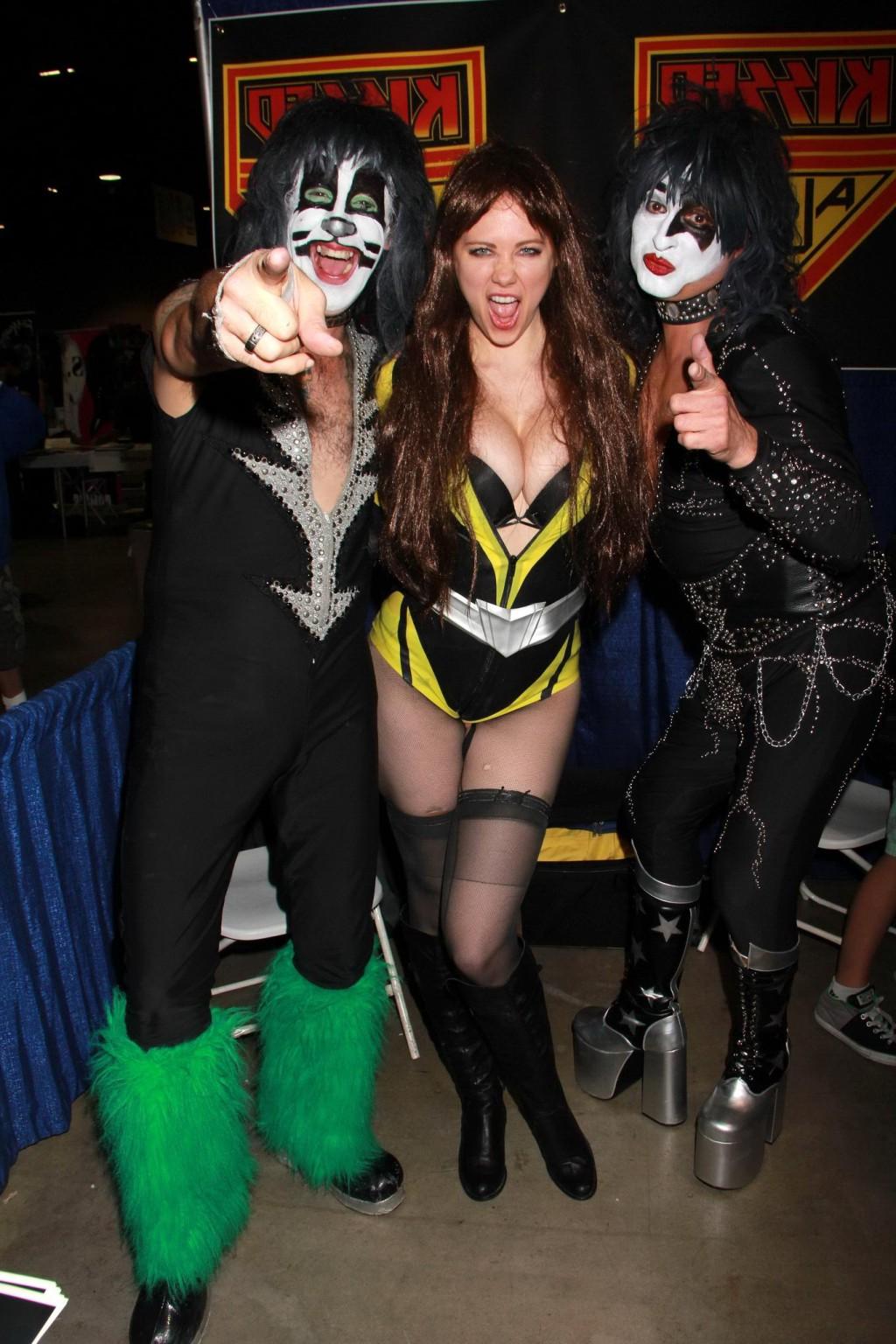 16P Busty Maitland Ward wearing latex bodysuit fishnets and boots at the Long Beach 