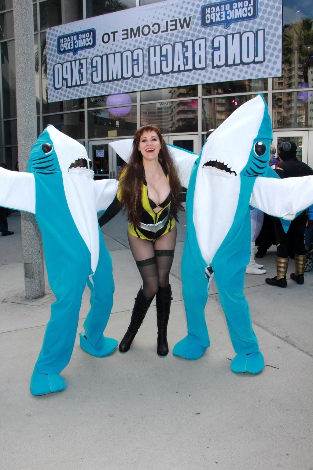 16P Busty Maitland Ward wearing latex bodysuit fishnets and boots at the Long Beach 