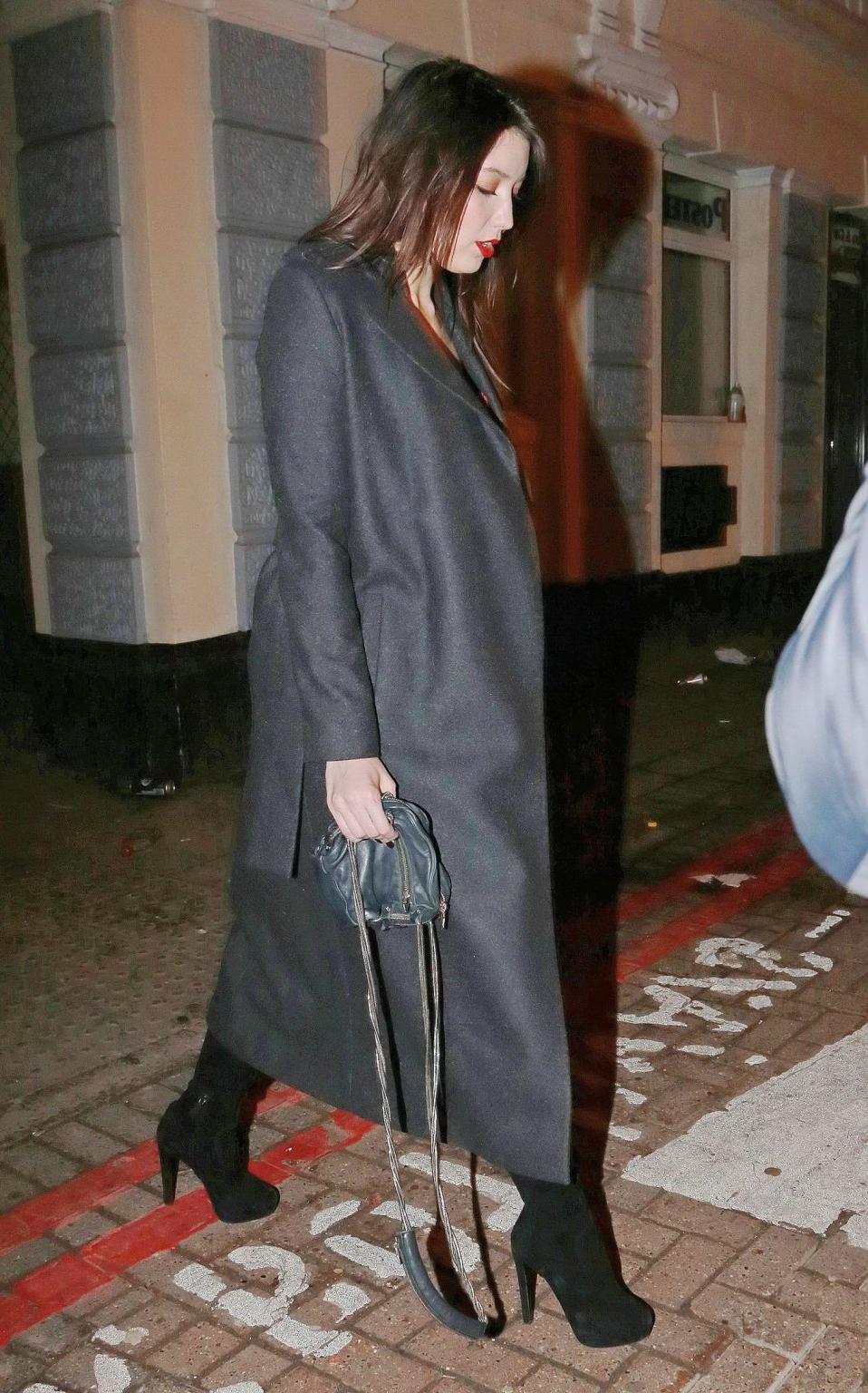 16P Busty Daisy Lowe wears red latex mini dress fishnets  fuckme boots leaving the W