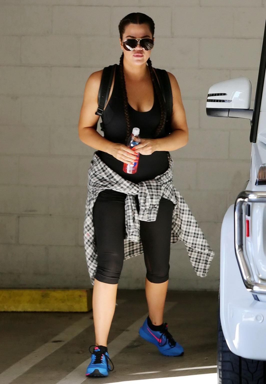 16P Khloe Kardashian busty wearing a black tanktop outside a gym in Beverly Hills