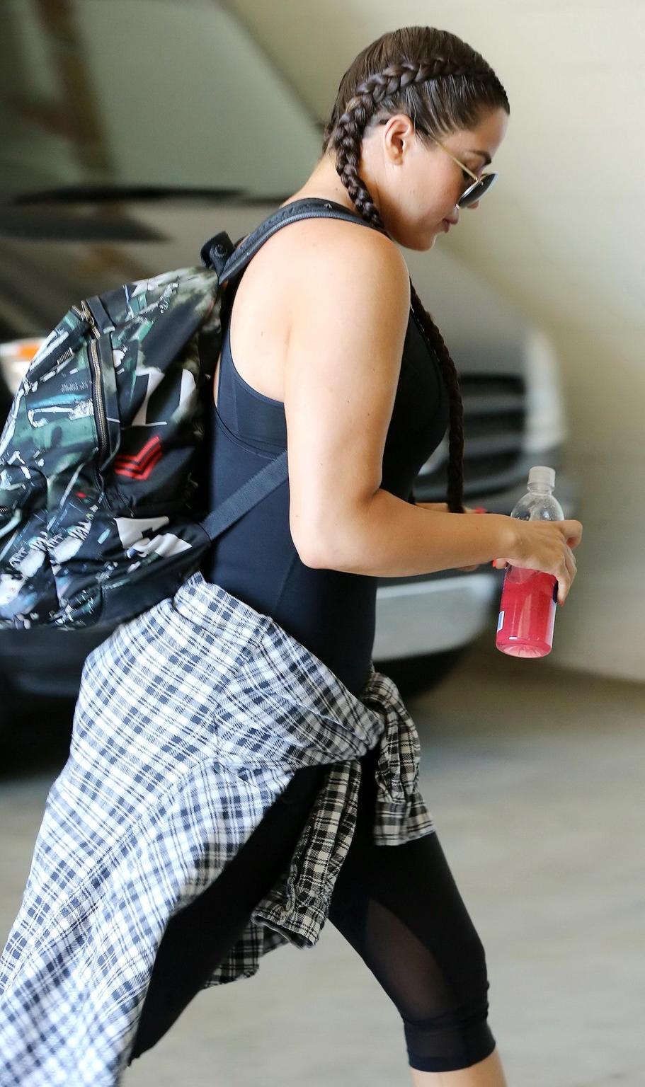 16P Khloe Kardashian busty wearing a black tanktop outside a gym in Beverly Hills