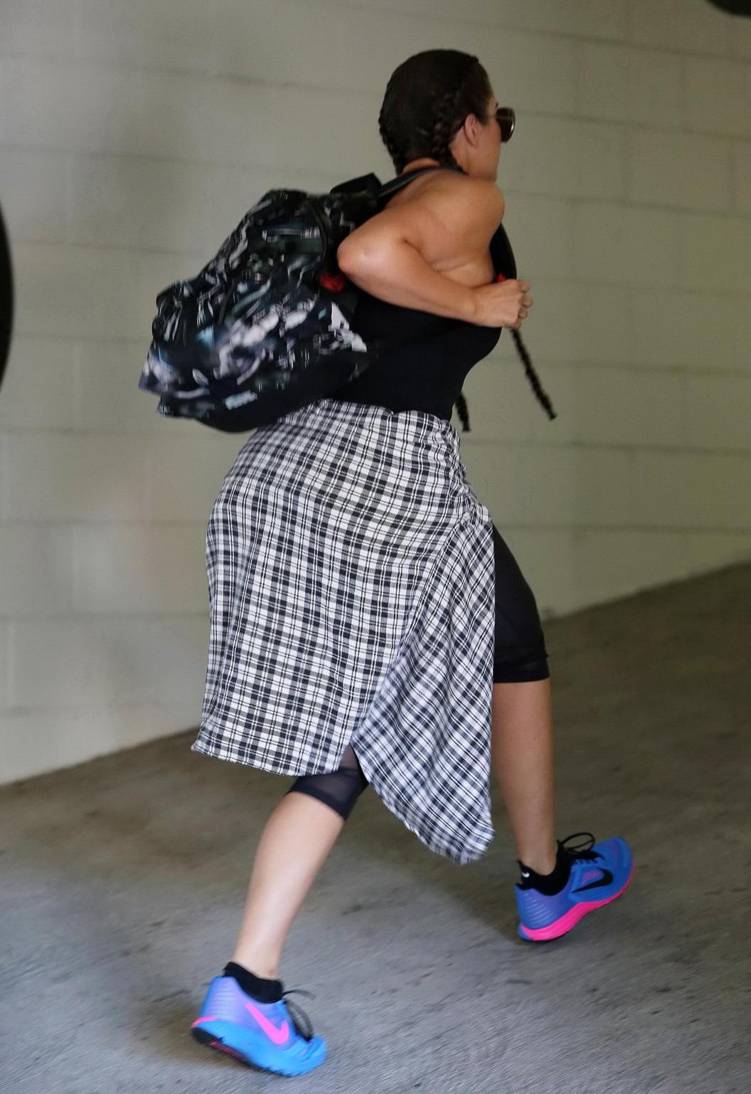 16P Khloe Kardashian busty wearing a black tanktop outside a gym in Beverly Hills