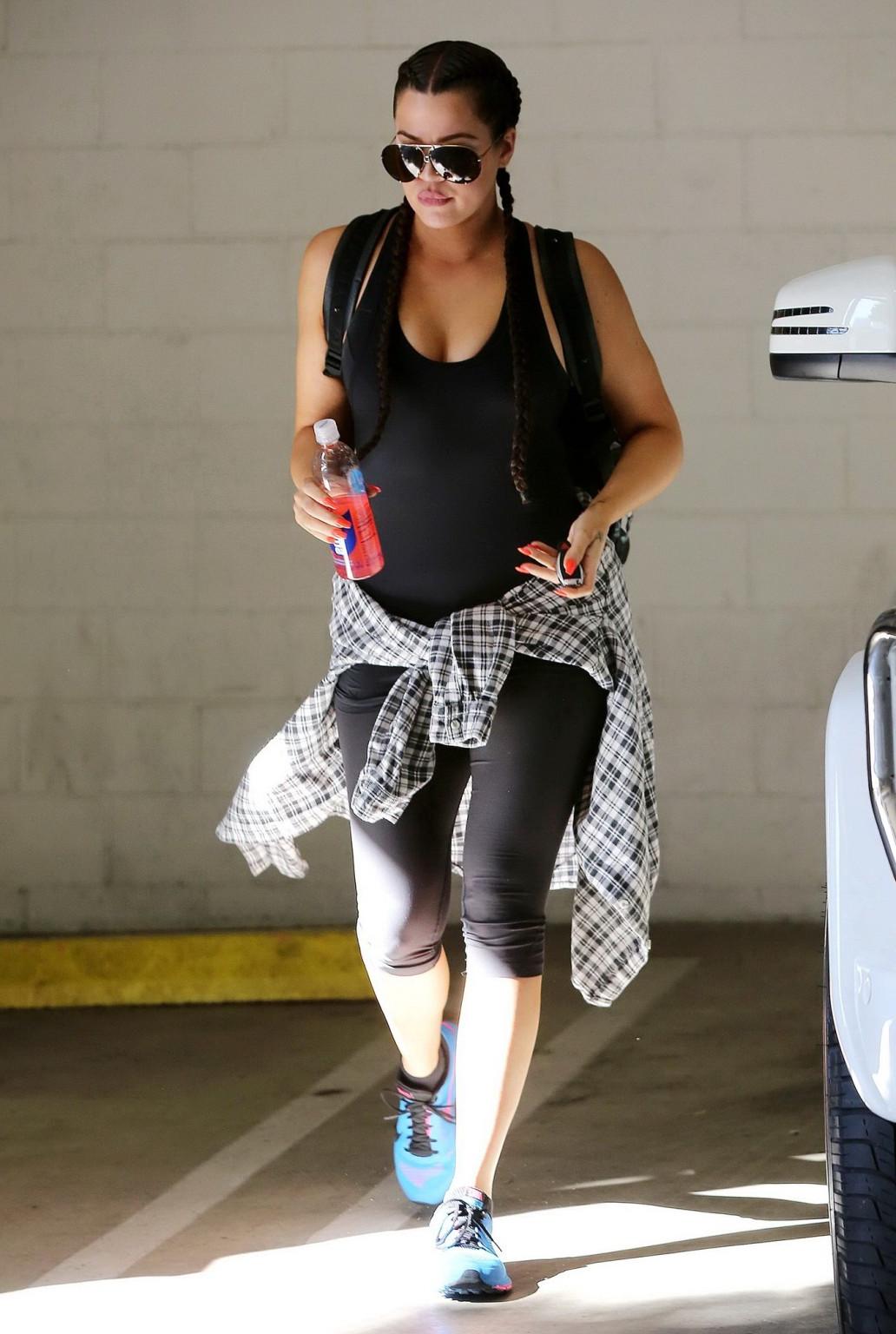 16P Khloe Kardashian busty wearing a black tanktop outside a gym in Beverly Hills