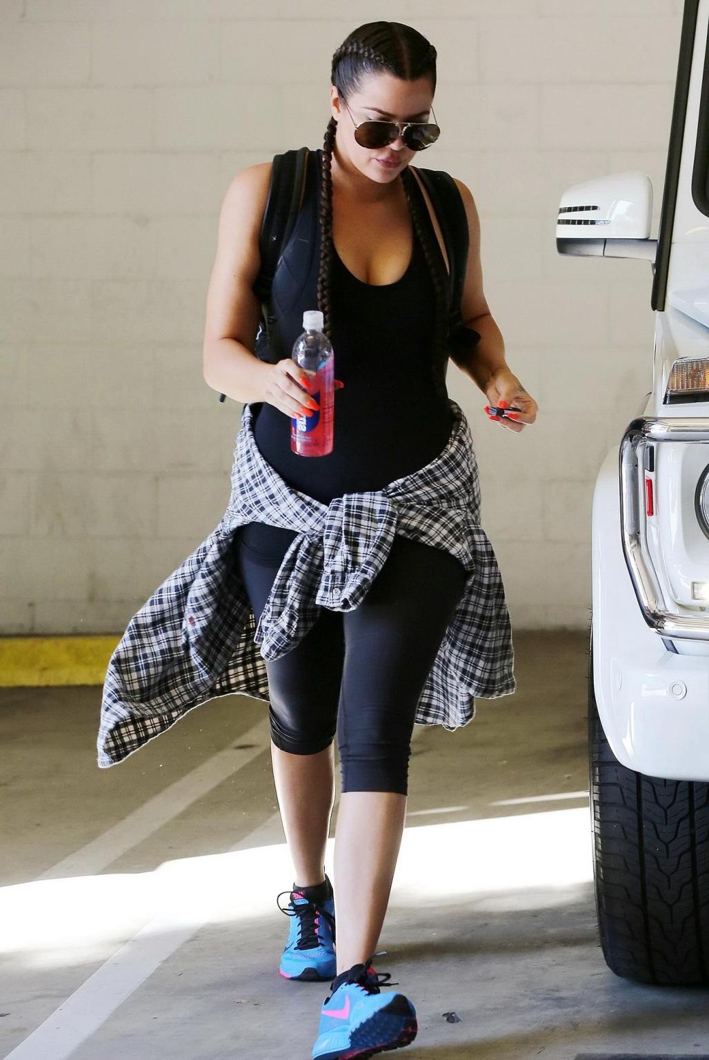 16P Khloe Kardashian busty wearing a black tanktop outside a gym in Beverly Hills