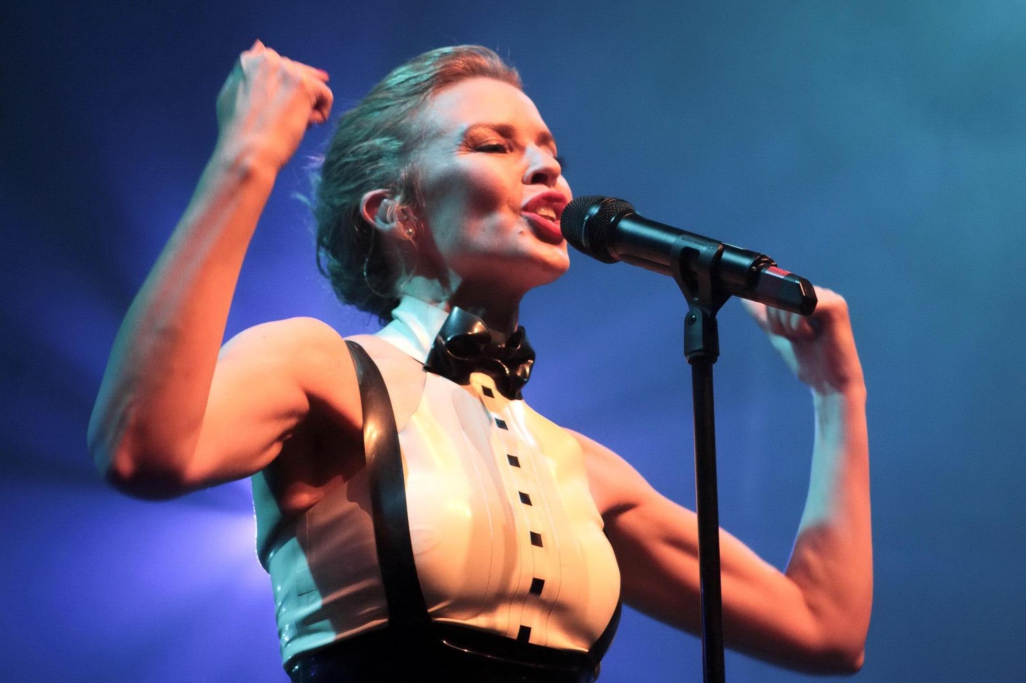 16P Kylie Minogue in tight latex dress performing on stage in Paris