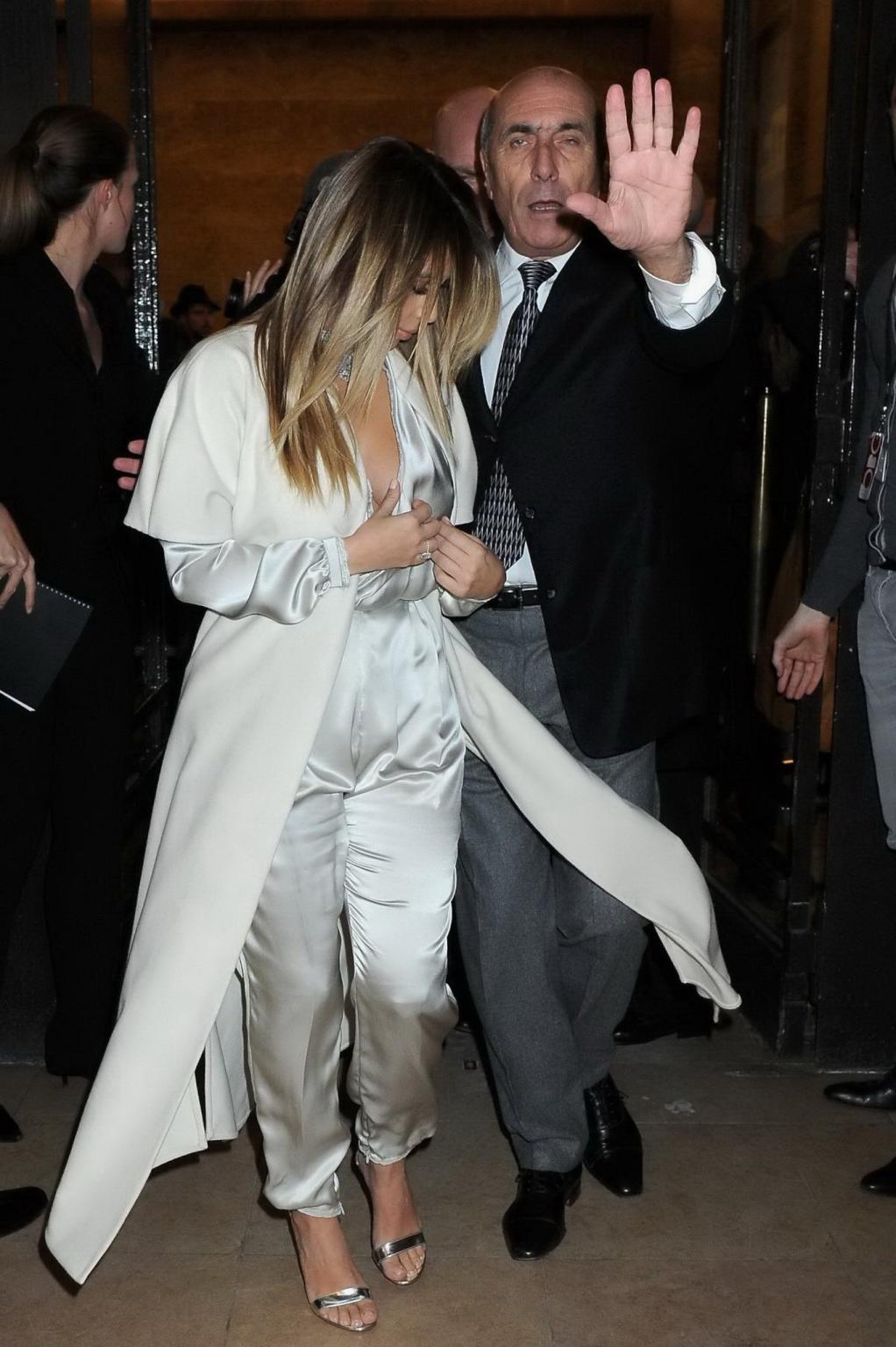 16P Kim Kardashian cleavy wearing low cut white satin gown at Stephane Rolland's fas