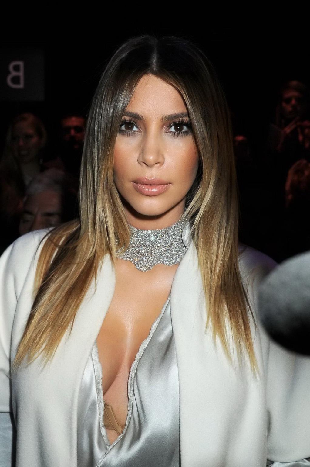 16P Kim Kardashian cleavy wearing low cut white satin gown at Stephane Rolland's fas