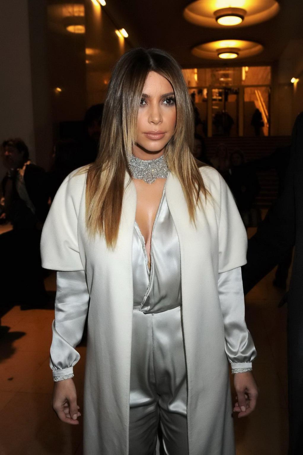 16P Kim Kardashian cleavy wearing low cut white satin gown at Stephane Rolland's fas