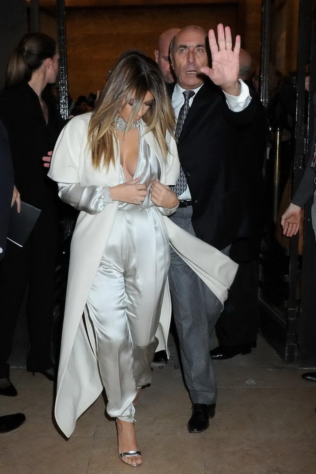 16P Kim Kardashian cleavy wearing low cut white satin gown at Stephane Rolland's fas