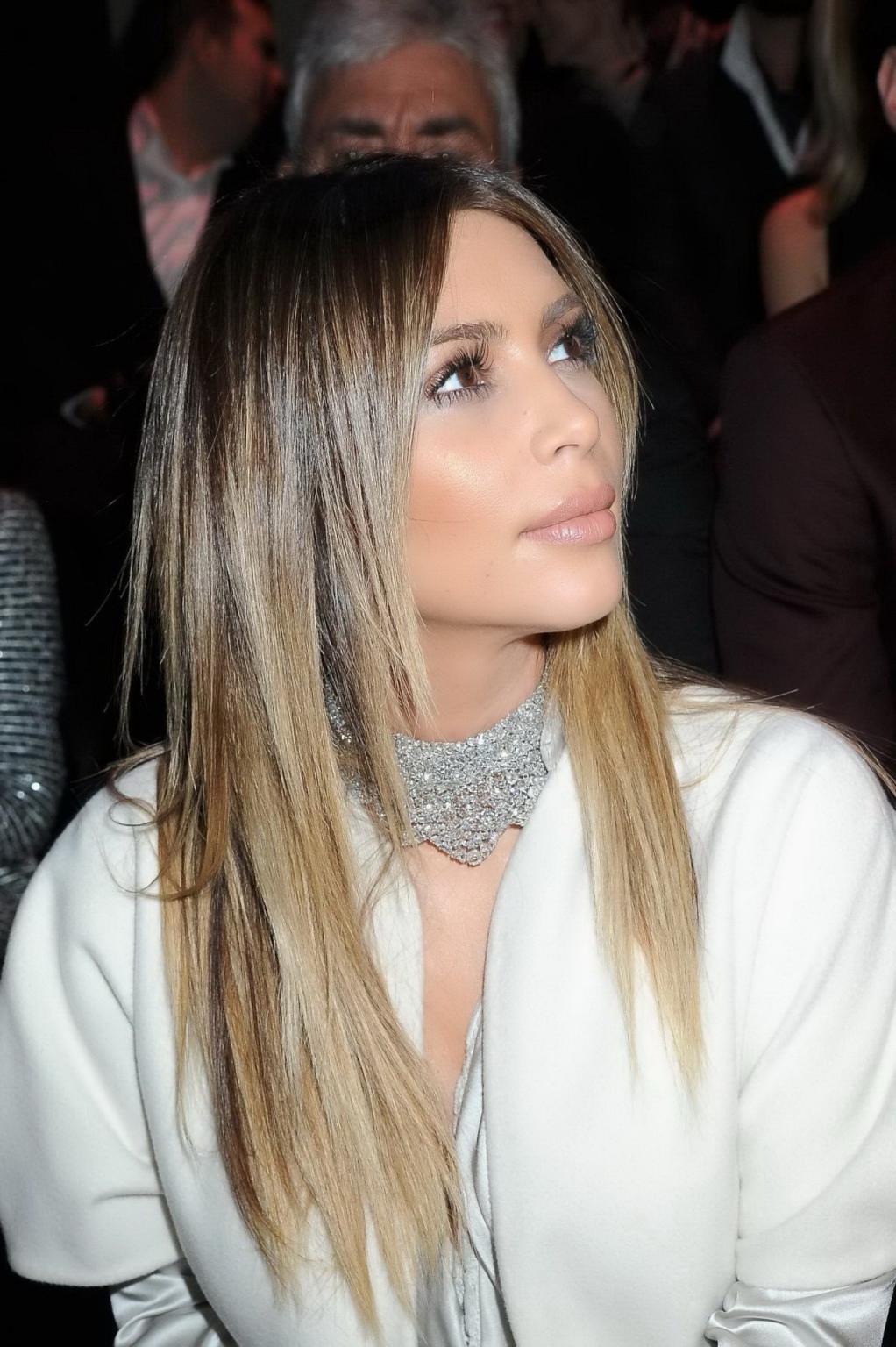 16P Kim Kardashian cleavy wearing low cut white satin gown at Stephane Rolland's fas