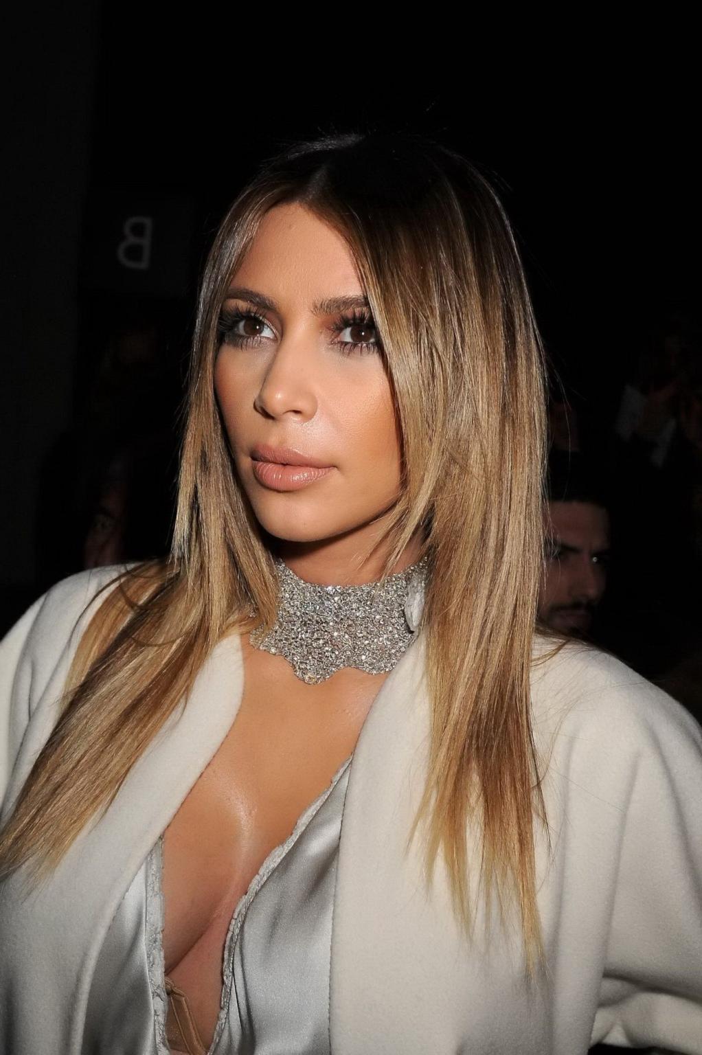 16P Kim Kardashian cleavy wearing low cut white satin gown at Stephane Rolland's fas