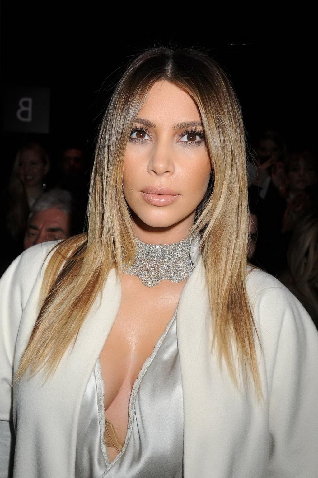 16P Kim Kardashian cleavy wearing low cut white satin gown at Stephane Rolland's fas