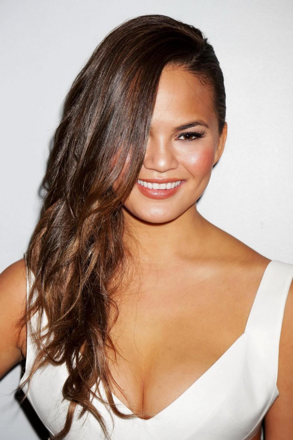 16P Chrissy Teigen showing huge cleavage at the Beach Bunny fashion show in Miami
