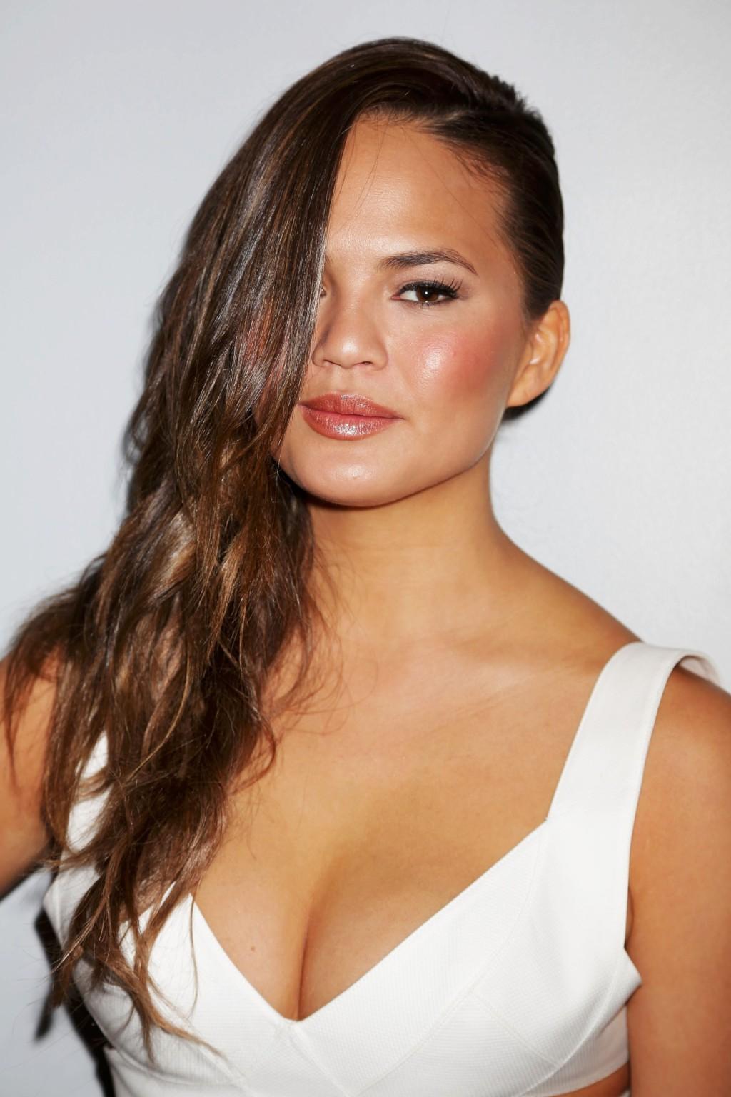 16P Chrissy Teigen showing huge cleavage at the Beach Bunny fashion show in Miami
