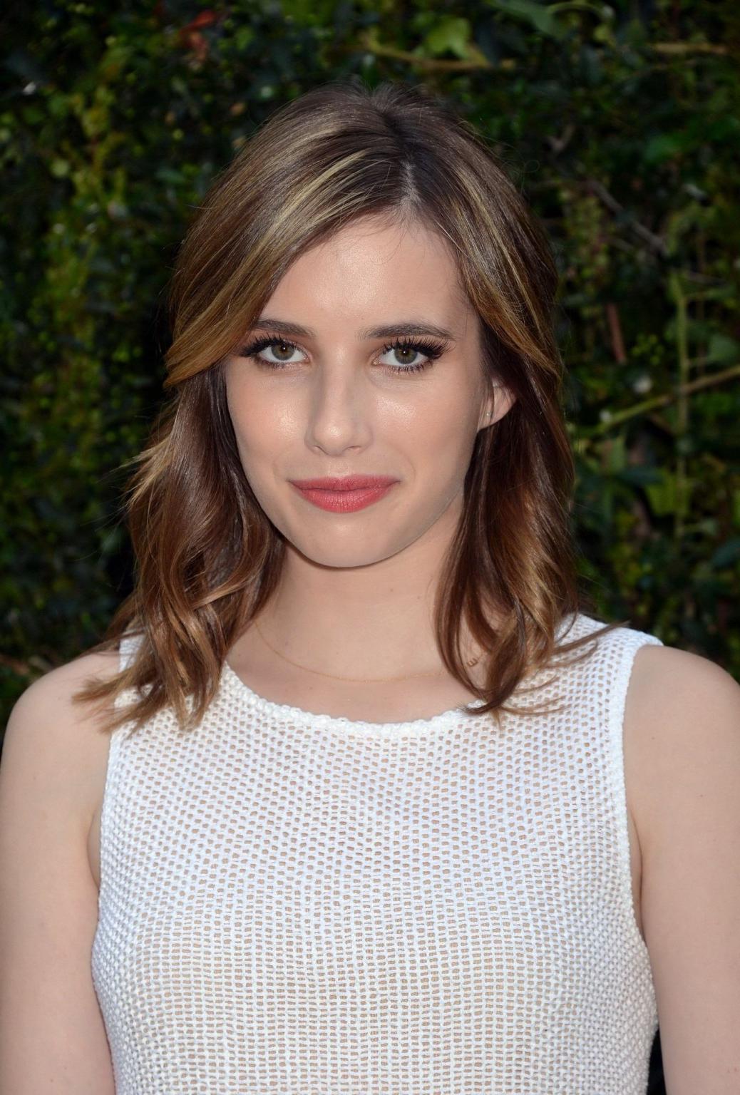 16P Emma Roberts looks hot wearing white fishnet mini dress at the NRDC Chanel Dinne