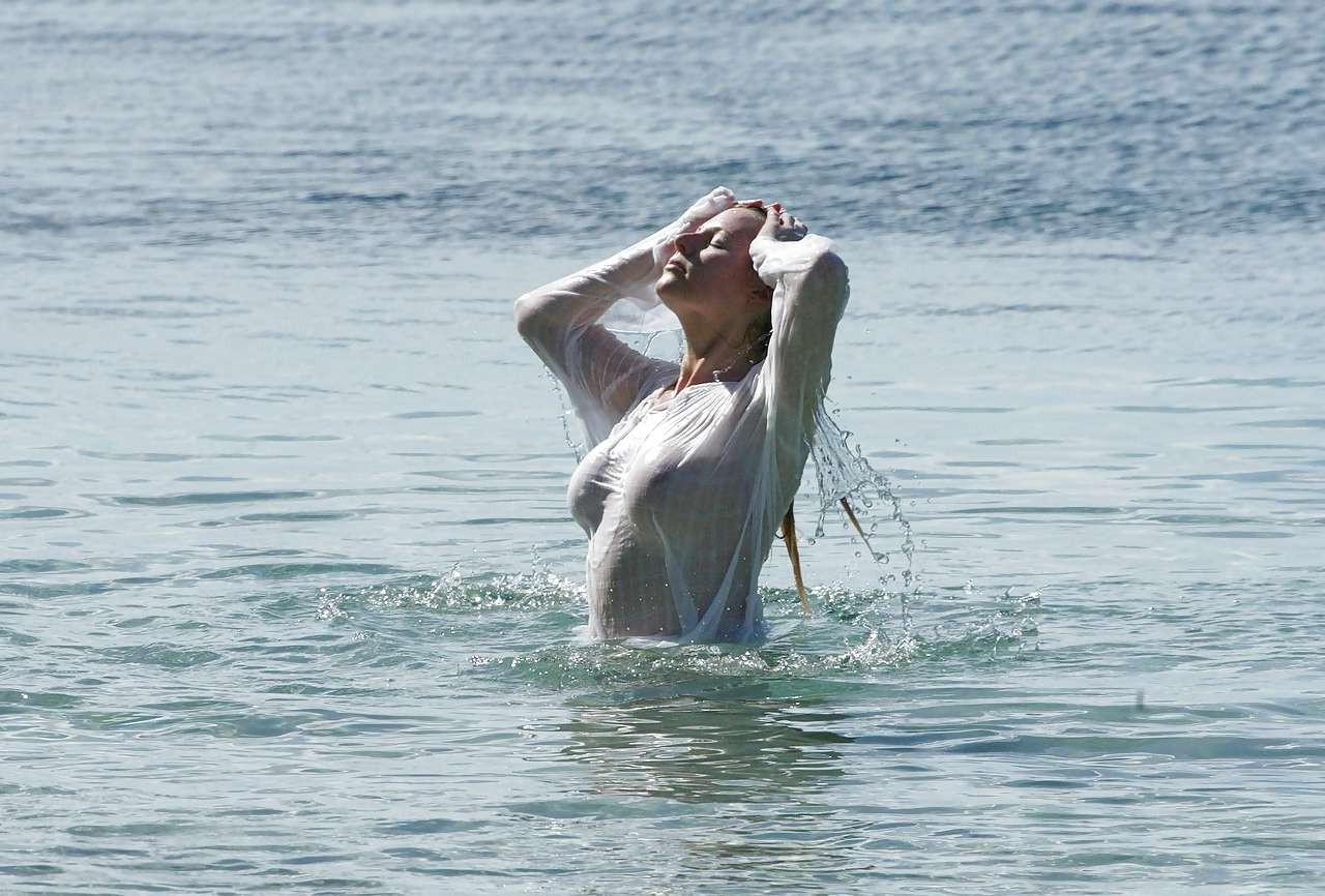 10P Abi Titmuss exposing her nice boobs in wet see thru dress