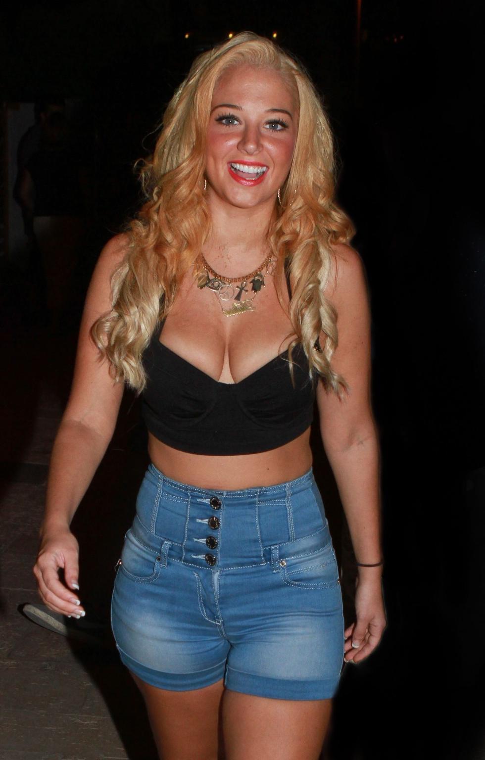 10P Tulisa Contostavlos busty wearing a low cut top outside the Ocean Club in Ibiza