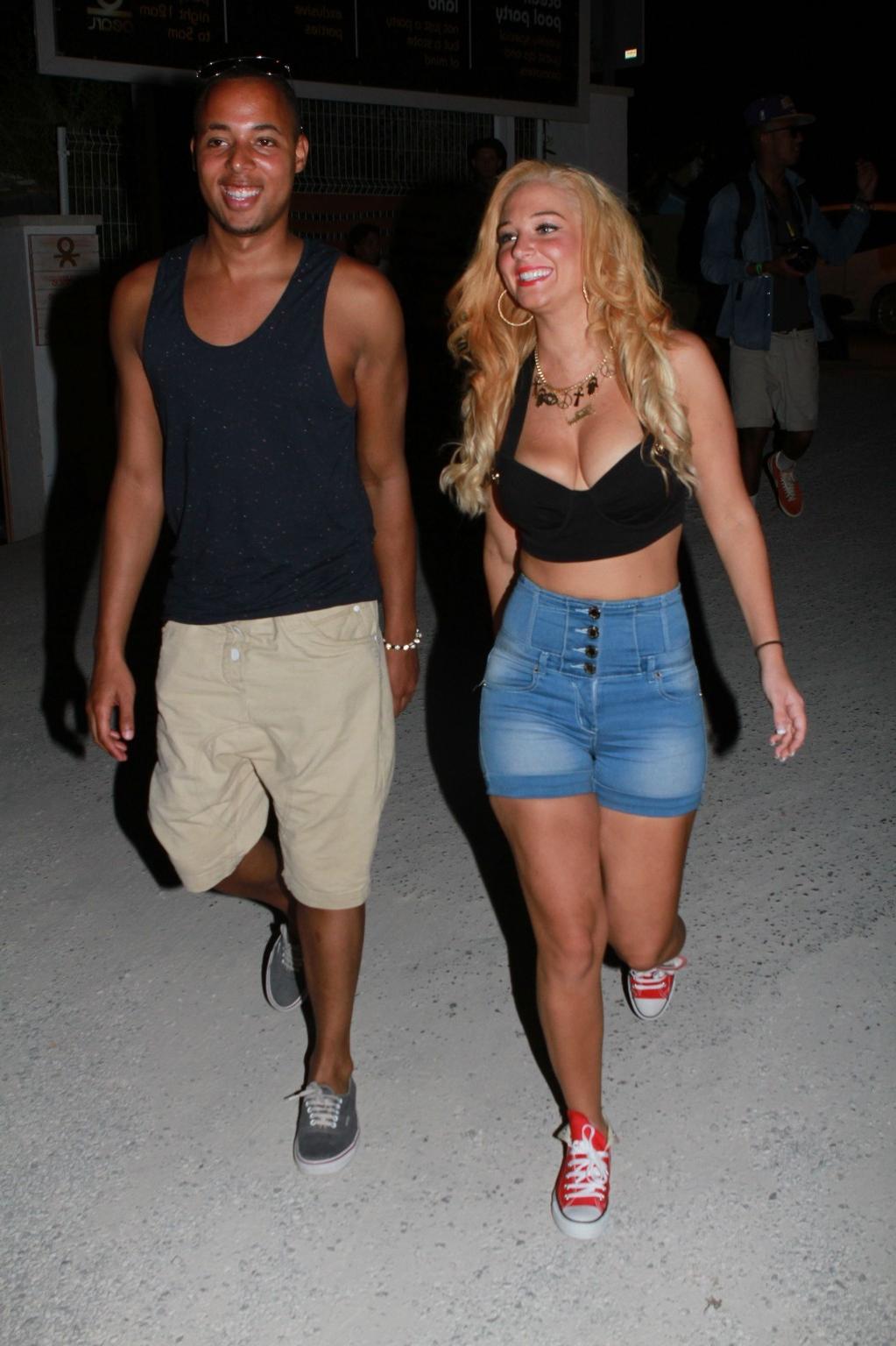10P Tulisa Contostavlos busty wearing a low cut top outside the Ocean Club in Ibiza