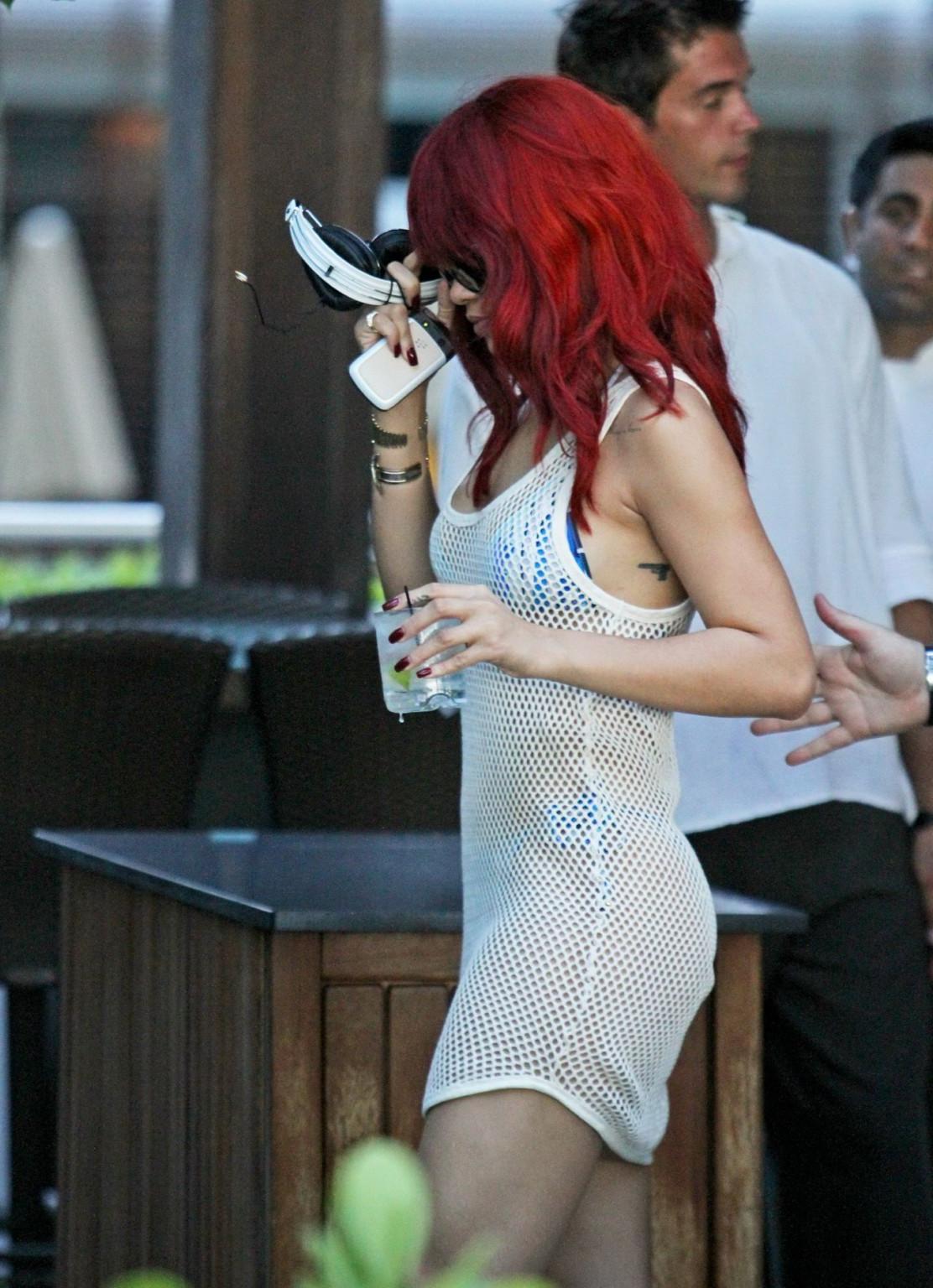 16P Rihanna wearing bikini  fishnet at the beach restaurant in Miami