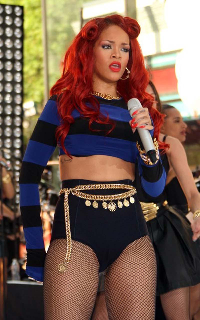 16P Rihanna very leggy in shorts and fishnet stockings on stage paparazzi pictures
