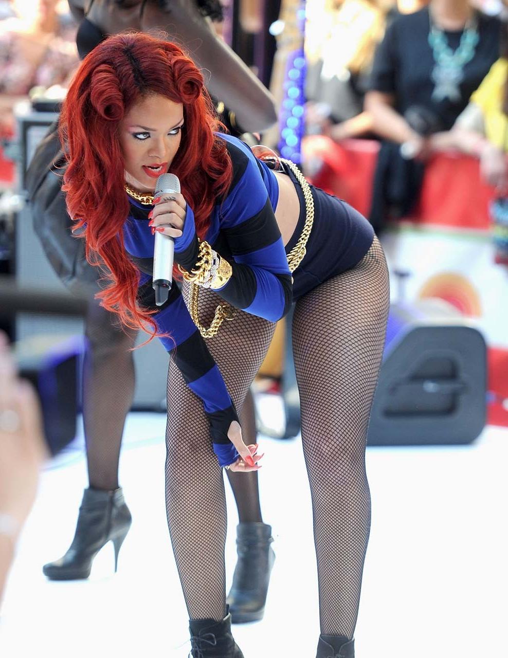 16P Rihanna very leggy in shorts and fishnet stockings on stage paparazzi pictures