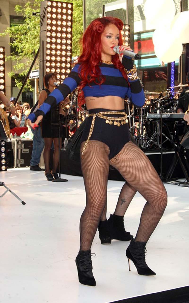16P Rihanna very leggy in shorts and fishnet stockings on stage paparazzi pictures