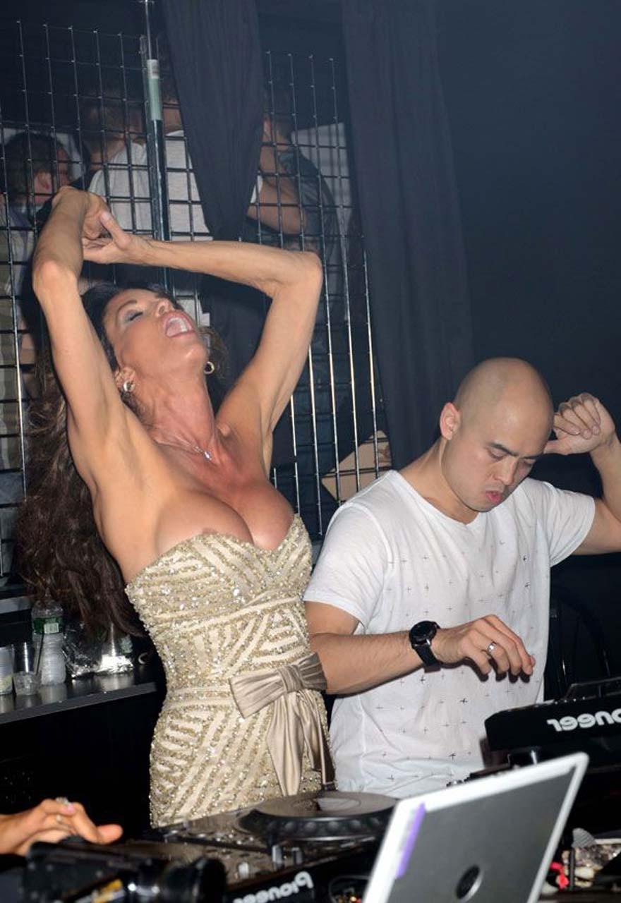 16P Janice Dickinson nipple slip while partying in club and upskirt paparazzi pictur