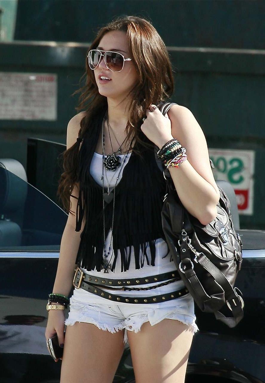 16P Miley Cyrus exposing her sexy body and nice boobs in wet clothes