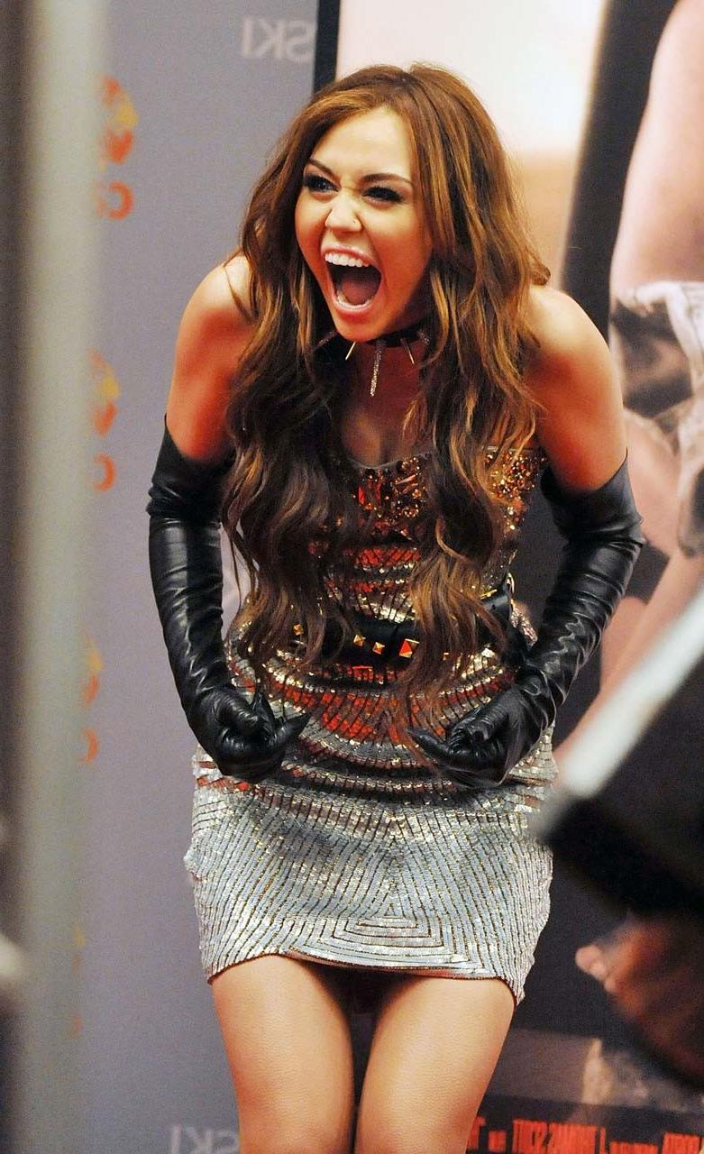 16P Miley Cyrus exposing her sexy body and nice boobs in wet clothes