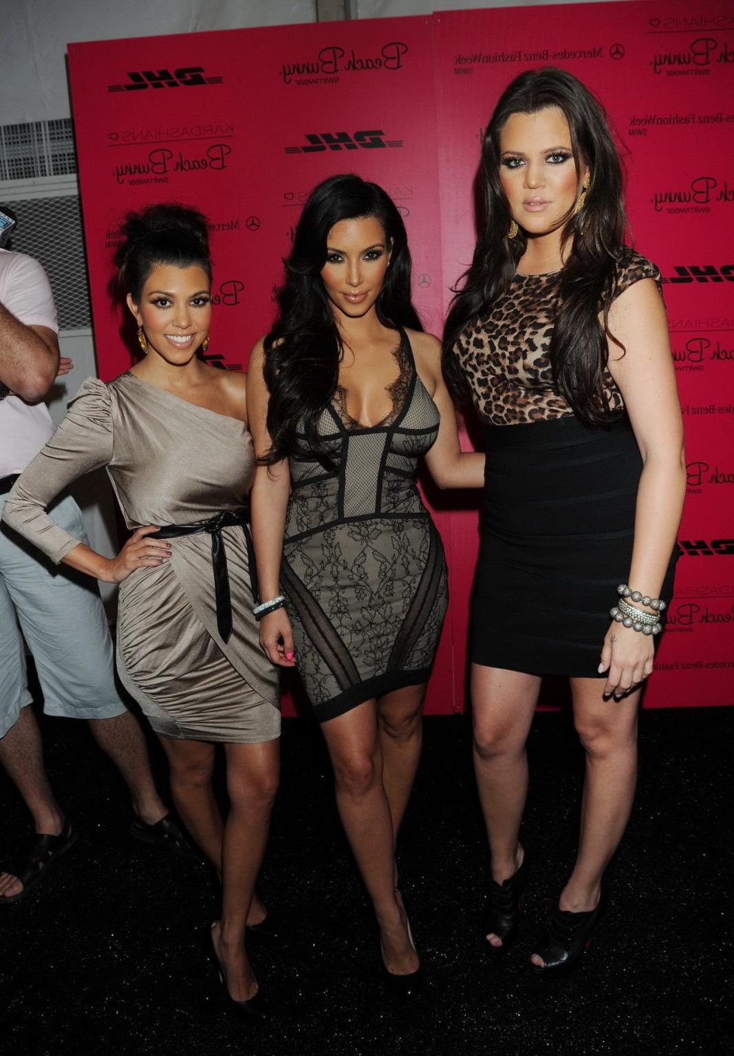 15P Busty Kim Kardashian showing huge cleavage at the Beach Bunny Swimwear fashion s