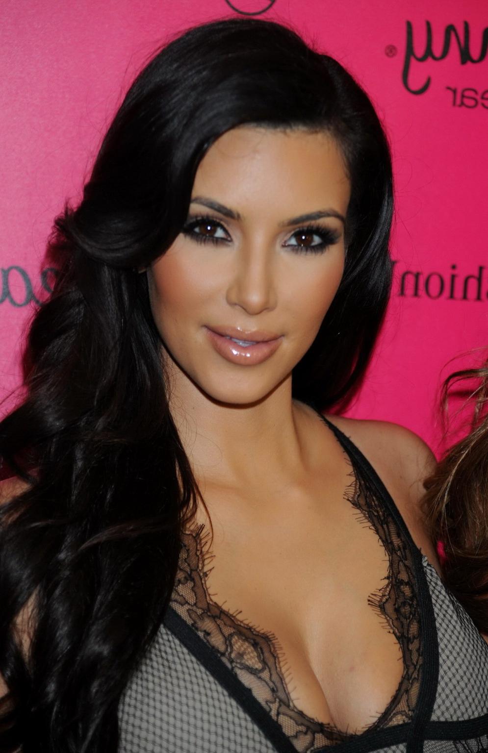 15P Busty Kim Kardashian showing huge cleavage at the Beach Bunny Swimwear fashion s