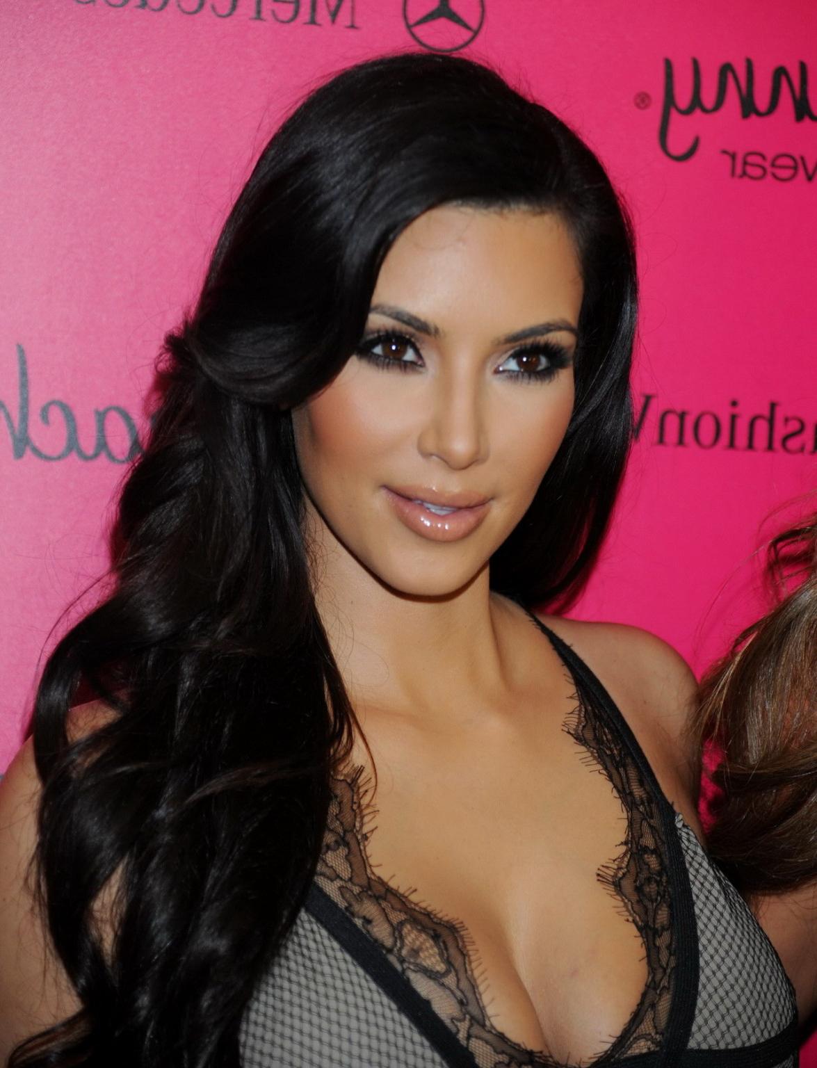15P Busty Kim Kardashian showing huge cleavage at the Beach Bunny Swimwear fashion s