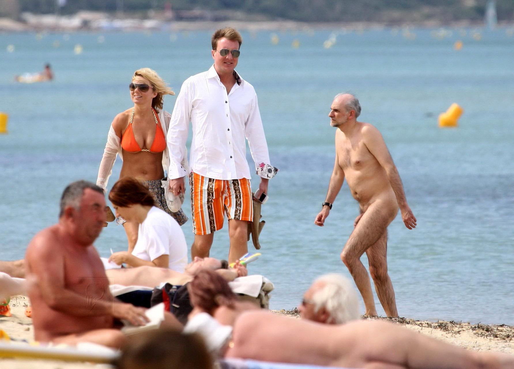15P Busty Geri Halliwell showing pokies in skimpy orange bikini at Club 55 beach in 