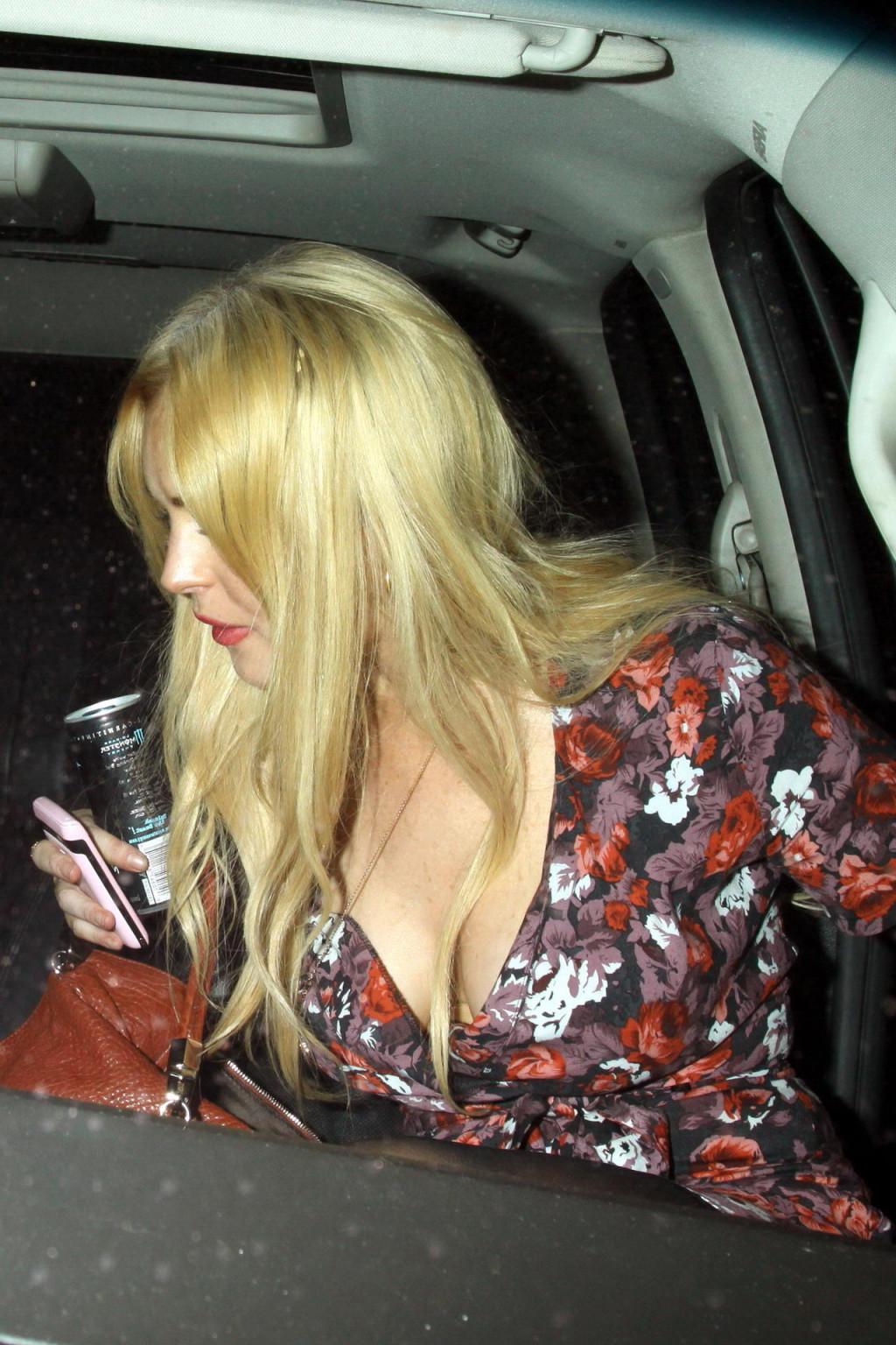 15P Lindsay Lohan leggy  cleavy in mini dress  ripped stockings leaving H. Wood Club