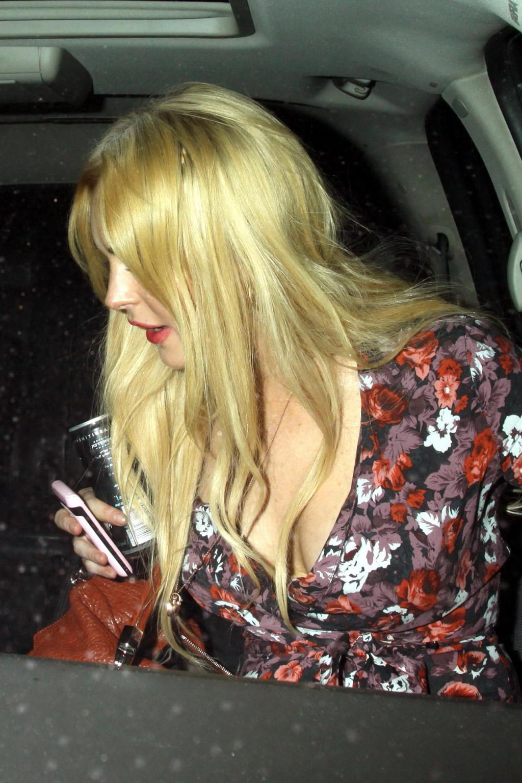 15P Lindsay Lohan leggy  cleavy in mini dress  ripped stockings leaving H. Wood Club
