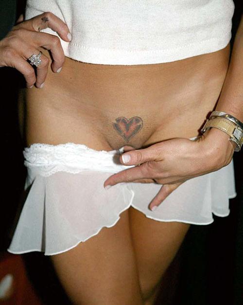 10P Katie Price Jordan exposing her big boobs in net shirt and tatoo above her pussy