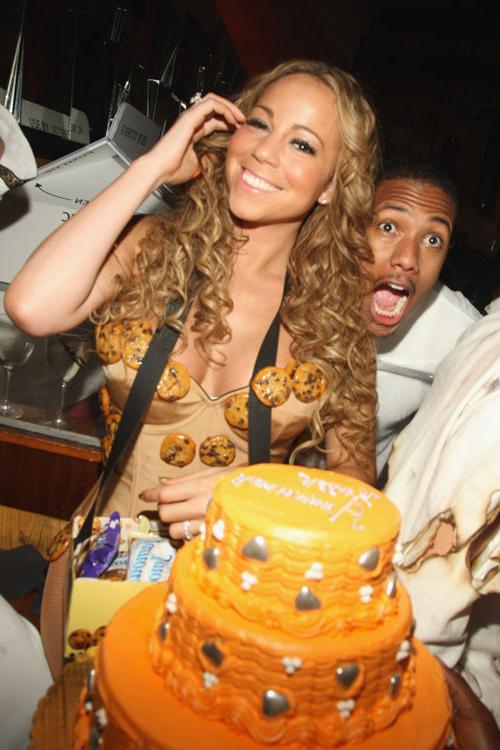 16P Mariah Carey showing her legs in fishnet stockings