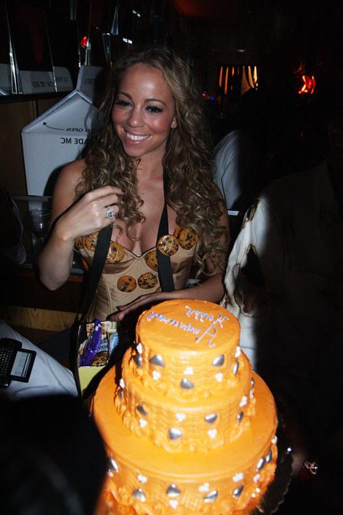 16P Mariah Carey showing her legs in fishnet stockings