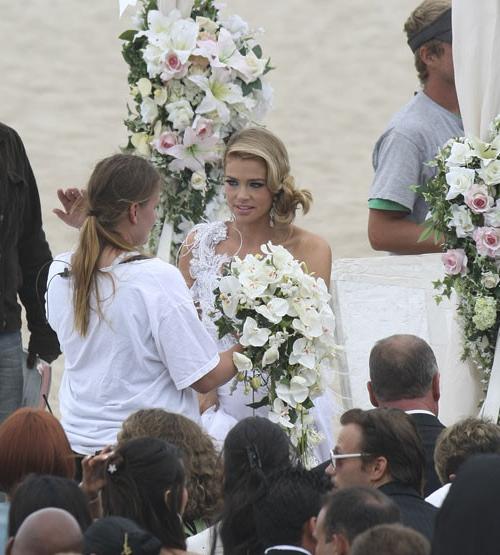 16P Denise Richards showing her big tits and posing in wedding dress