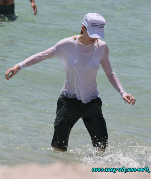 16P Madonna showing her hairy pussy and tits in wet seethru shirt