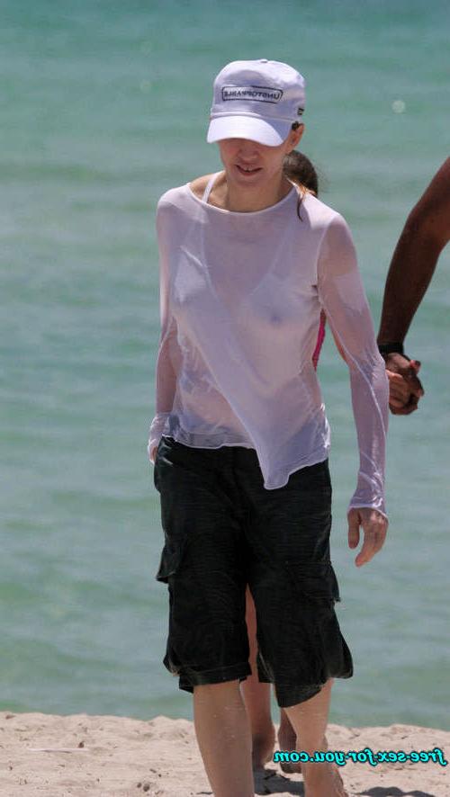 16P Madonna showing her hairy pussy and tits in wet seethru shirt